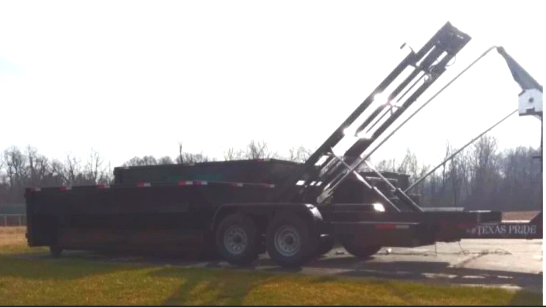 Texas Pride dump trailer with hydraulic hoist used for Skeels deliveries